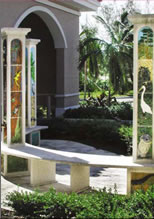 Courtyard with benches and columns with images on columns